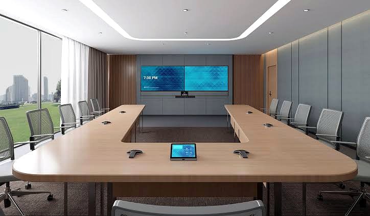 Sala de directorio con videoconferencia, doble pantalla, barra de video y panel táctil